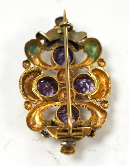 An early 20th century gilt metal and amethyst paste cluster set brooch, 44mm. Condition -poor.